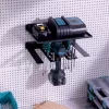 Suport cu raft scule electrice Navaris, 3 unelte, 31.5x22x4.5 cm, montaj perete/pegboard, negru, metal