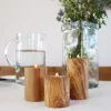 Set 3 suporturi pentru lumanari tip pastila din lemn de maslin, 6/8/10 cm, diametru 5.5 cm